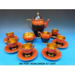 A Carltonware coffee set in Art Deco style comprising coffee pot, six cups and saucers, sugar bowl,