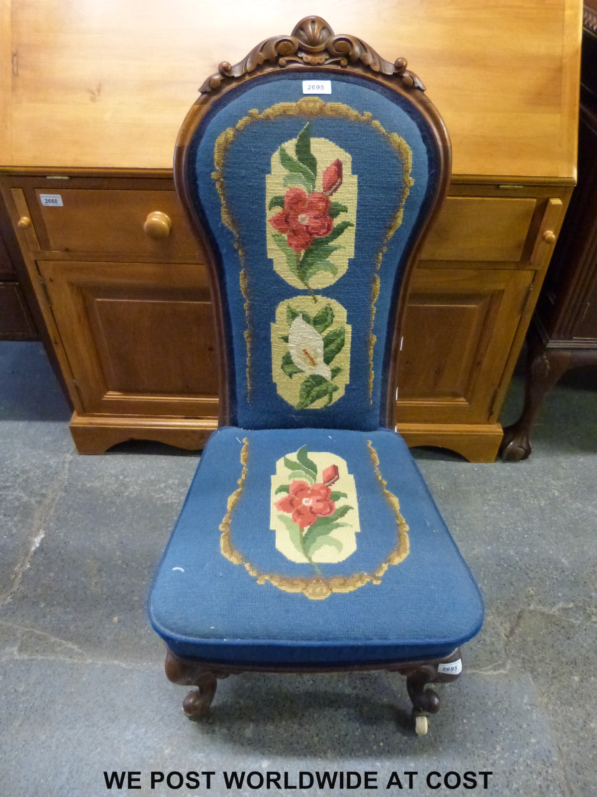 A Victorian mahogany prie dieu chair raised on carved cabriole supports