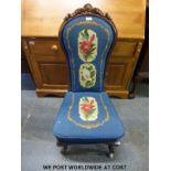 A Victorian mahogany prie dieu chair raised on carved cabriole supports