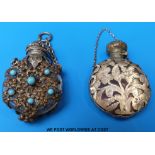 Two glass scent bottles with all over pierced white metal decoration,