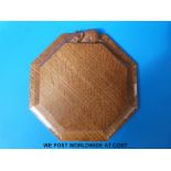 An octagonal carved teapot stand or clock back,