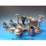 A collection of pewter items including Art Nouveau, stag taper holders,