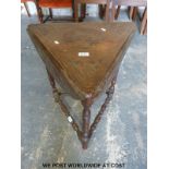 An early 19thC carved drop flap cricket table (height 62cm)