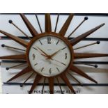A c1970 "Sunburst" Smiths wall clock with early battery movement