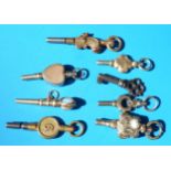 Seven Victorian gold watch keys including one set with an opal,