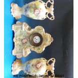 A late Victorian porcelain clock garniture with gilt floral decoration 'Japy Freres' movement to