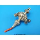 A silver and coral baby's rattle, teether and whistle B/ham 1902, maker's mark C&A,