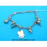 A charm bracelet marked 9ct with six charms (14.