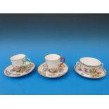 Two Naples/Capodimonte relief decorated cups and saucers and a Dresden example