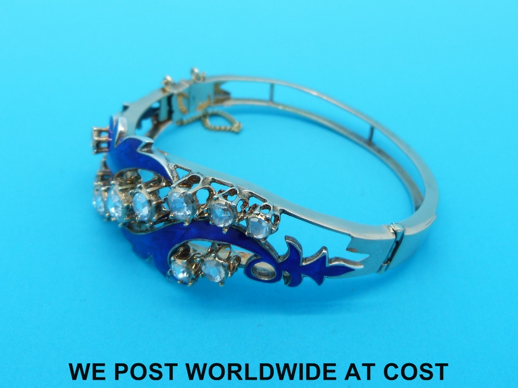 A yellow metal bangle set with 13 rose cut diamonds and blue enamel in a scrolling foliate design - Image 3 of 4