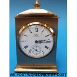 A small brass mantel clock by Astral of Gt Britain