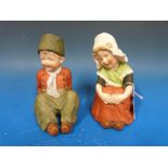 Two German bisque boy and girl piano figures