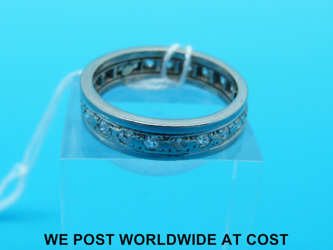 A white metal ring with diamonds channel set around the band (size V) - Image 2 of 2