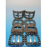 Four pairs of 19thC cut steel rectangular shoe buckles all decorated with a border of circular cut