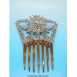 A 19thC cut steel hair comb with star design of small faceted stones