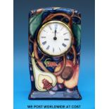 A Moorcroft mantel clock in the Queen's Choice pattern (15cm tall)