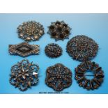 Eight cut steel brooches in mainly floral designs to include one set with agate and one Art Deco