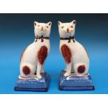 A pair of Staffordshire cats (18cm tall)