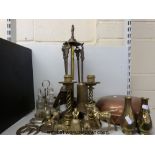A quantity of brass items to include a companion set, twist design candlesticks,
