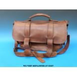 A vintage brown leather Messenger bag with multiple compartments and shoulder strap