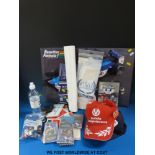 Two Formua 1 caps, a freestanding promotional picture, key rings, driver's gloves, paddock passes,