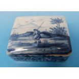 A Delft blue and white patch box decorated with landscape scene with figure,