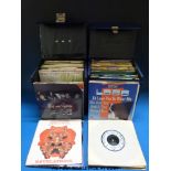 Over 300 45rpm single vinyl records in five cases, largely 1980s but includes 1960s,