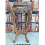 A Chinese carved wooden table / jardiniere stand (91cm tall,