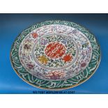 A large Chinese charger with gilt rim and all over decoration of symbolised stylised floral pattern,