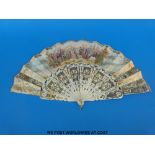 A 19thC pierced and carved bone fan elaborately decorated in gilt and silver,