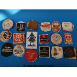 A collection of English and European beer mats,