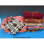 A collection of textiles to include woven silk saris, Kashmir embroideries and others from Nepal,