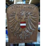 A carved wooden Austrian national award plaque with national arms to centre,
