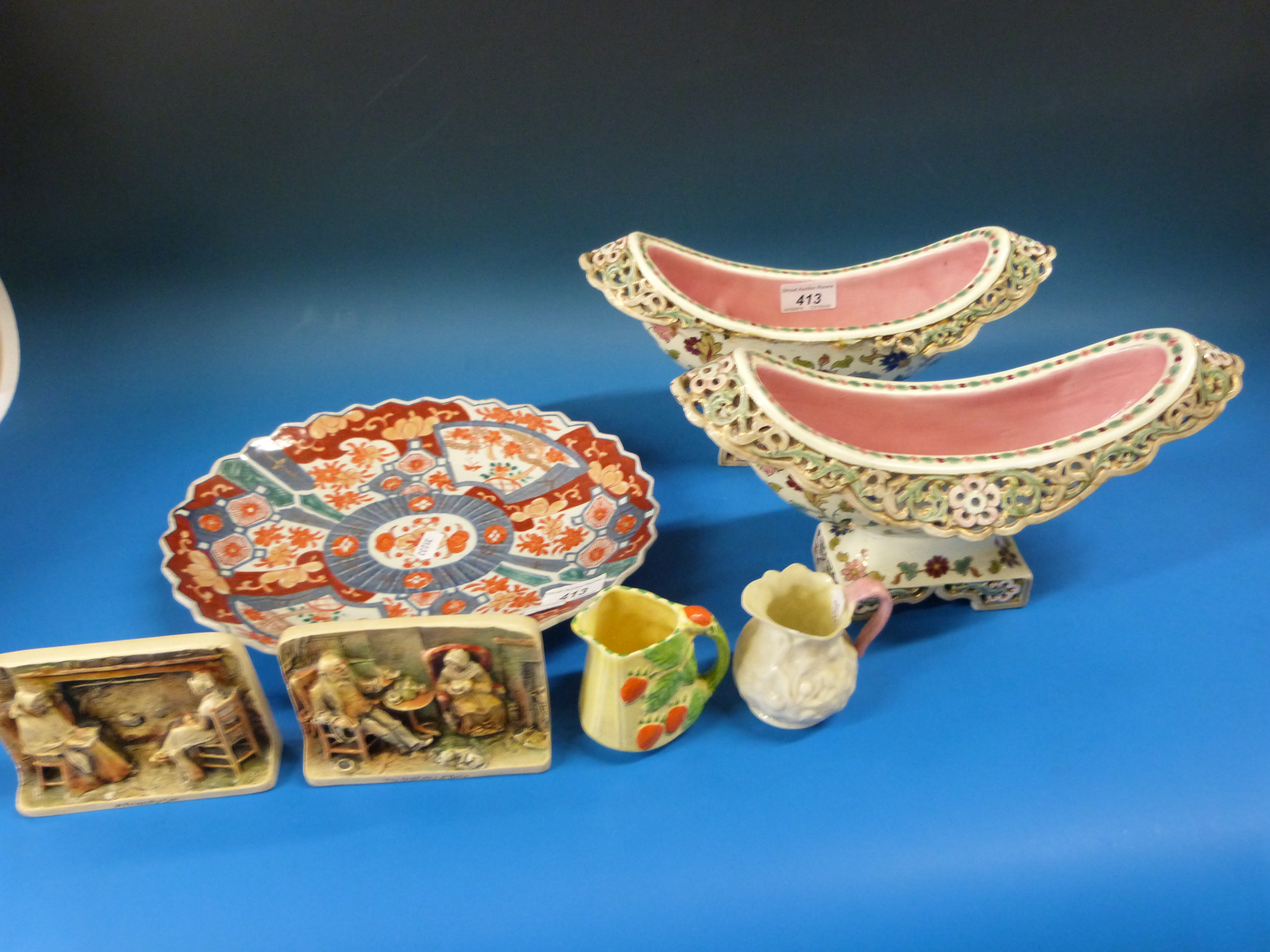 A pair of pierced oval jardinieres, probably by Zsolnay Pecs together with a Japanese Imari dish,