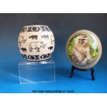 Two painted African ostrich eggs,
