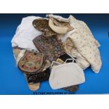 A quantity of textiles to include a collection of gloves, vintage bags to include beaded,