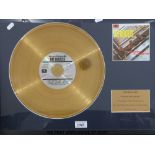 A framed (18” x 23”) “Gold” disc of The Beatles “Please Please Me” LP.