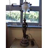 A decorative figural bronze-style table lamp with floral glass shade (height 66cm)