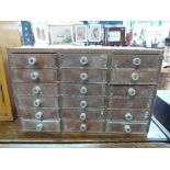 A set of miniature haberdashery/collector's drawers comprising 18 drawers (w32.5 x d22.