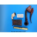 A collection of pipes including hallmarked silver mounted Meerschaum treen box and a bone