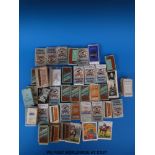 A collection of cigarette cards in packets, some full sets, including loose Ogdens film stars etc,
