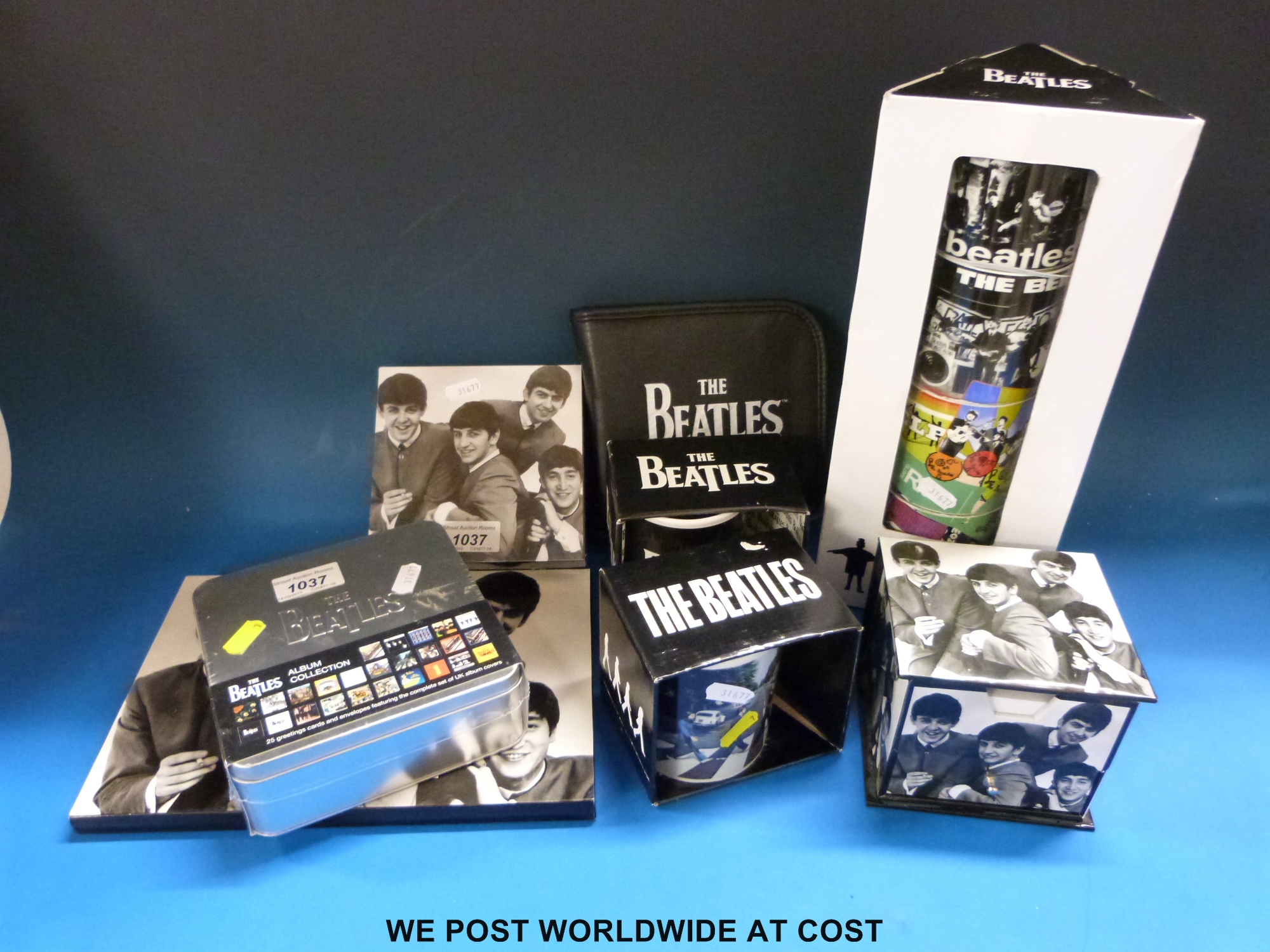 A collection of Beatles mugs, notelets,