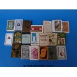 A tray of largely advertising playing cards (shipping lines,