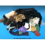 A collection of Victorian clothing, hats, feathers, clips,