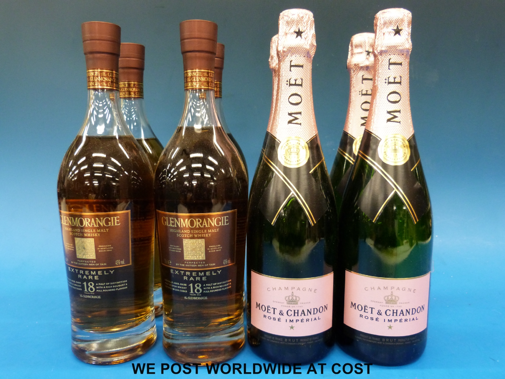 Four Moet & Chandon Rose Imperial champagne dummy bottles together with four Glenmorangie extremely