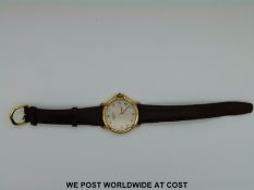 A Raymond Weil gentleman's gold plated wristwatch with date aperture, on leather strap,