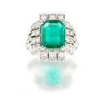 Art Deco emerald and diamond ring claw-set to the centre with an emerald-cut emerald weighing
