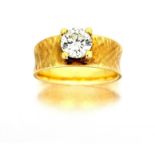 Diamond single-stone ring claw-set with a round brilliant-cut diamond weighing approximately 0.85 to
