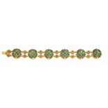 Emerald and diamond bracelet designed as six emerald and diamond openwork rondels, each connected by