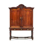 A Cape stinkwood cabinet-on-stand, late 18th century the gabled pediment carved with a pierced